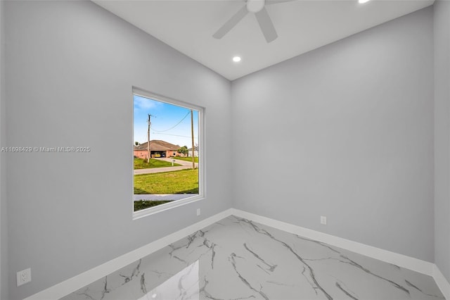 spare room featuring ceiling fan