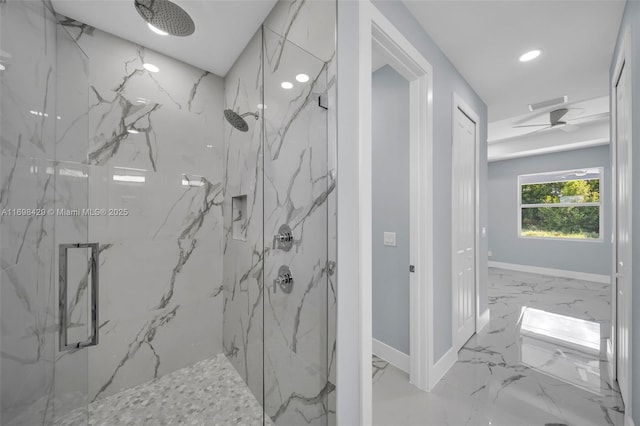 bathroom featuring ceiling fan and an enclosed shower