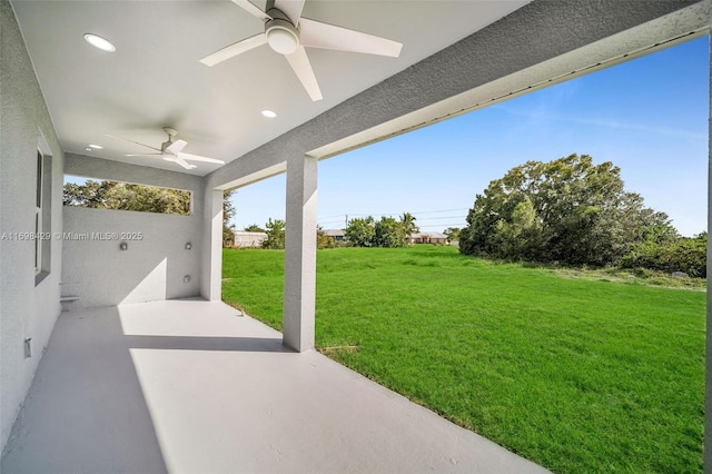 view of patio featuring ceiling fan