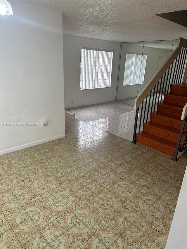 empty room with a textured ceiling