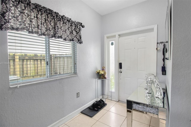 entrance foyer featuring light tile patterned floors