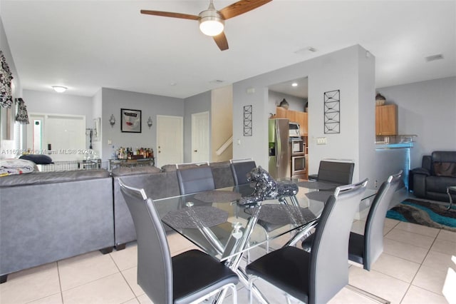 dining room with ceiling fan and light tile patterned floors