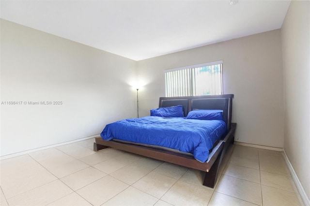 bedroom featuring light tile patterned floors