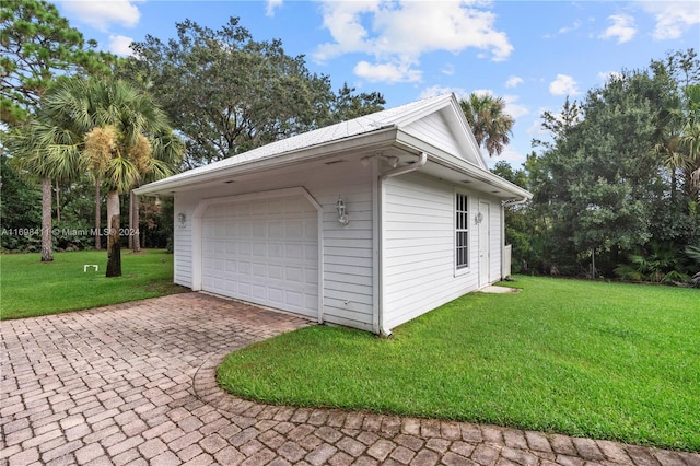 garage featuring a yard