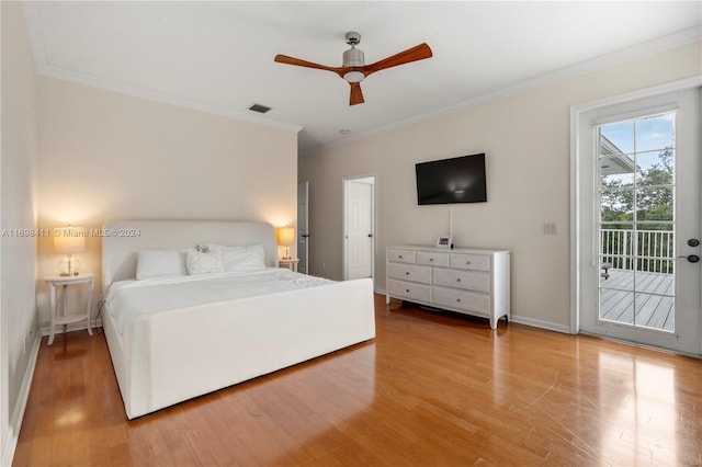 bedroom with hardwood / wood-style flooring, ceiling fan, access to exterior, and ornamental molding