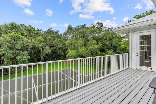 deck featuring a lawn