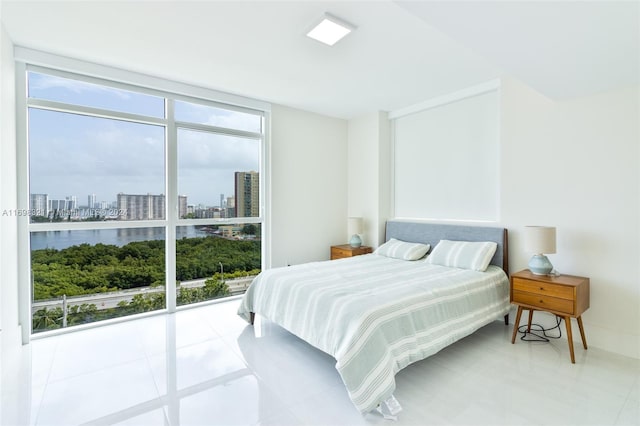 tiled bedroom with a wall of windows