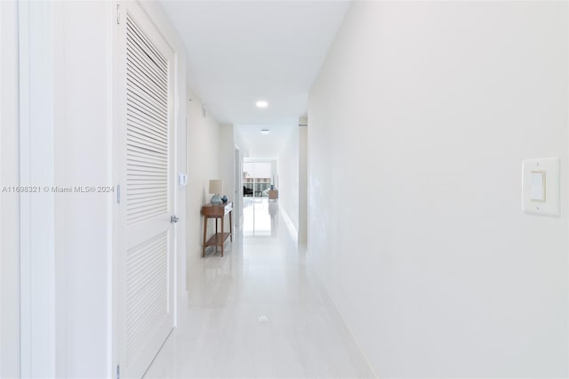 corridor featuring light tile patterned floors