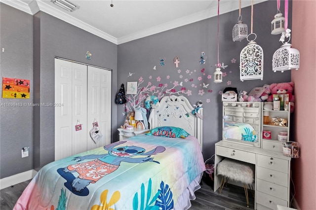 bedroom featuring wood-type flooring, crown molding, and a closet