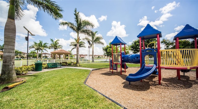 view of jungle gym with a lawn