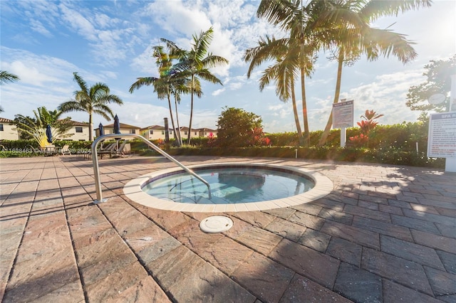 view of swimming pool with a community hot tub and a patio