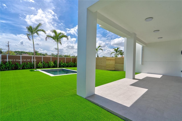 view of yard with a patio area and a swimming pool