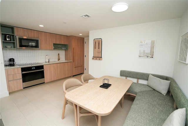 dining space featuring sink