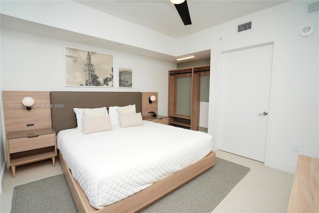 bedroom with ceiling fan and a closet