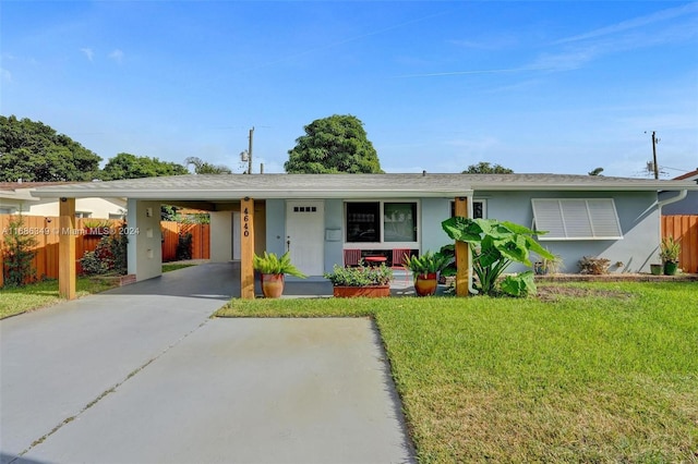 single story home featuring a front yard and a carport