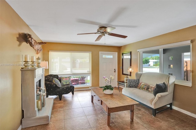 tiled living room with ceiling fan