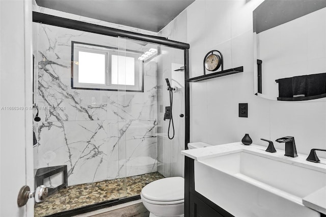 bathroom featuring an enclosed shower, vanity, toilet, and tile walls