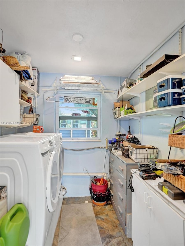 laundry area with washing machine and dryer