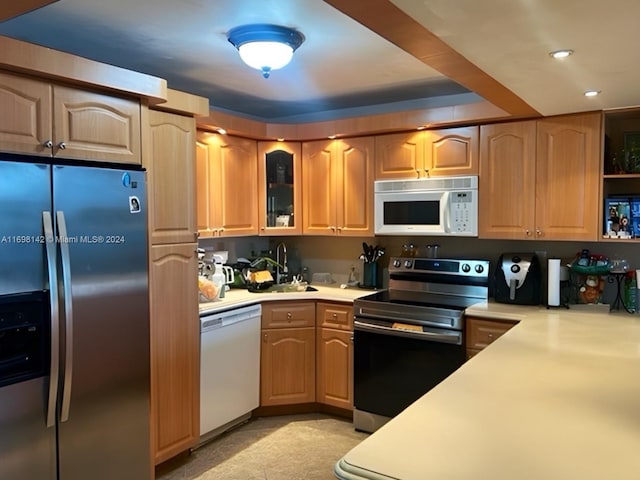 kitchen featuring stainless steel appliances and sink