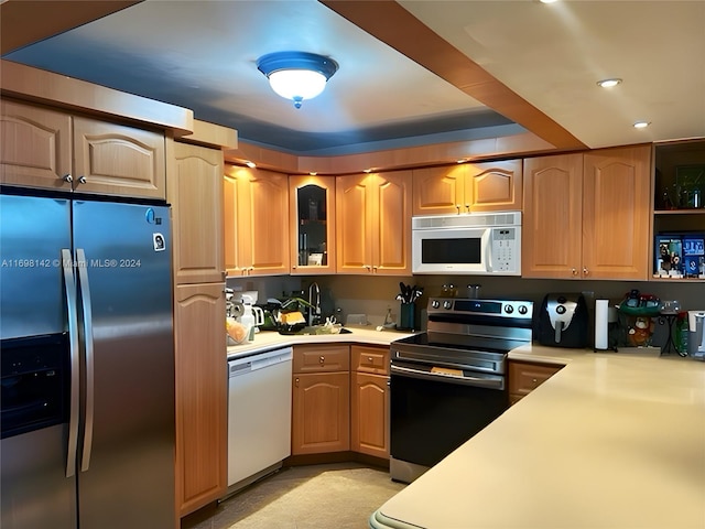 kitchen with sink and appliances with stainless steel finishes