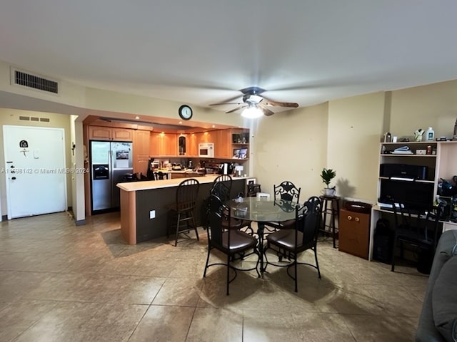 dining room featuring ceiling fan