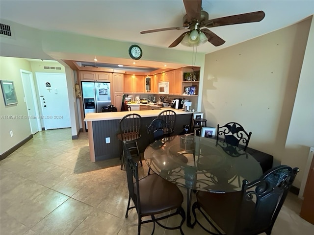 dining room featuring ceiling fan