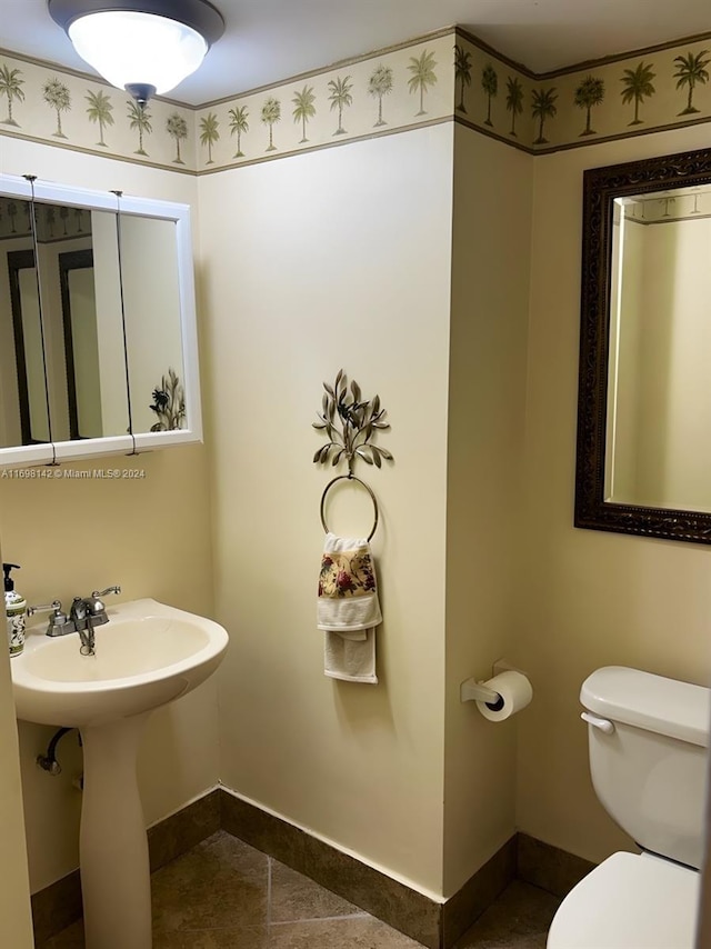 bathroom featuring tile patterned floors and toilet