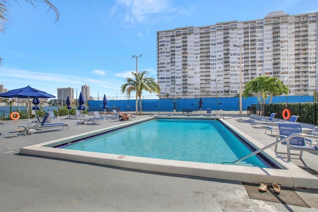 view of swimming pool featuring a patio area