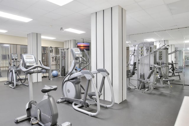 exercise room featuring a paneled ceiling