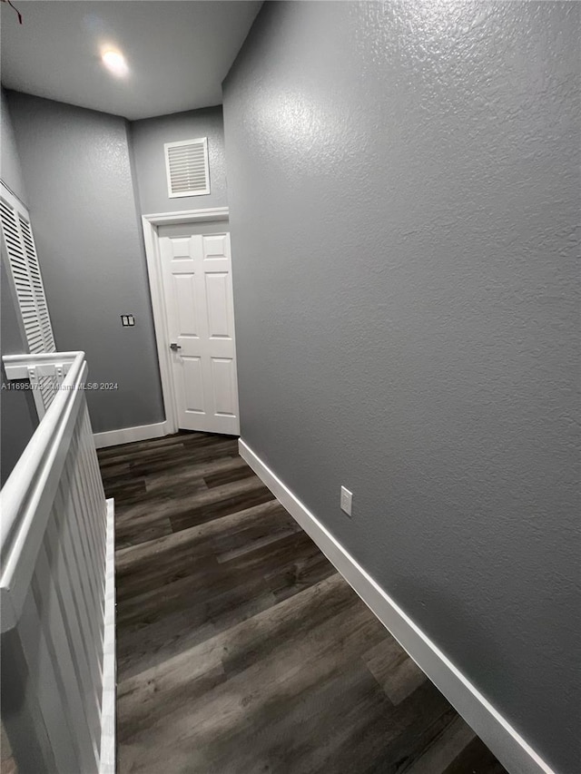 hall featuring dark wood-type flooring