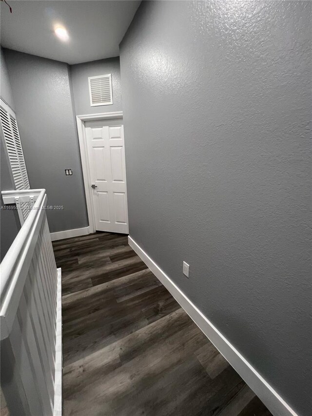 spare room with dark hardwood / wood-style flooring