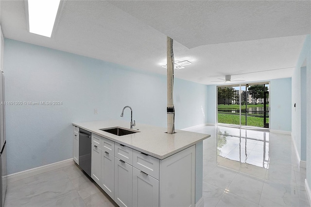 kitchen with a textured ceiling, ceiling fan, sink, dishwasher, and white cabinets