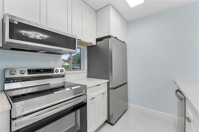 kitchen with white cabinets and stainless steel appliances