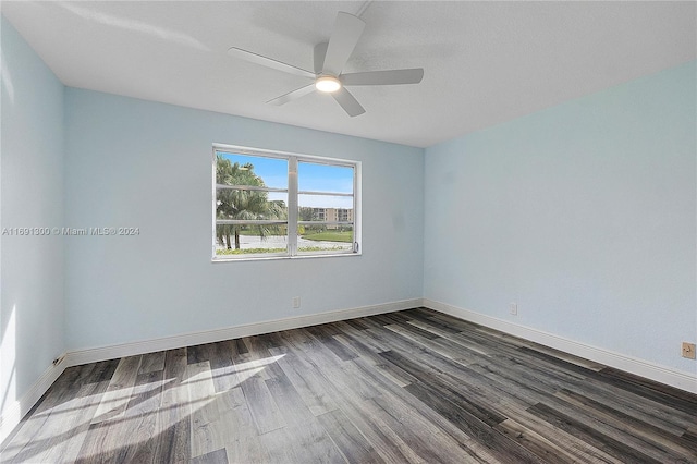 spare room featuring hardwood / wood-style floors and ceiling fan