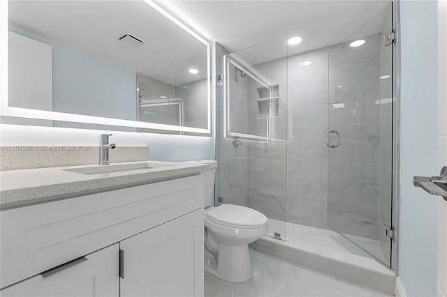 bathroom with an enclosed shower, vanity, and toilet