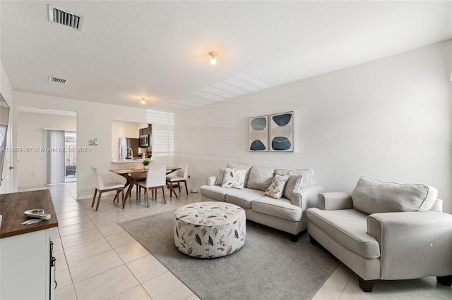 living room with light tile patterned floors