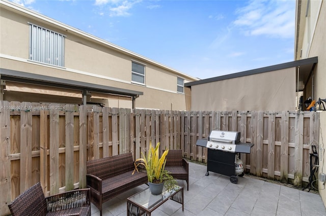 view of patio featuring a grill