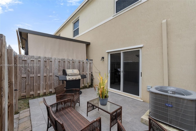 view of patio featuring area for grilling and cooling unit