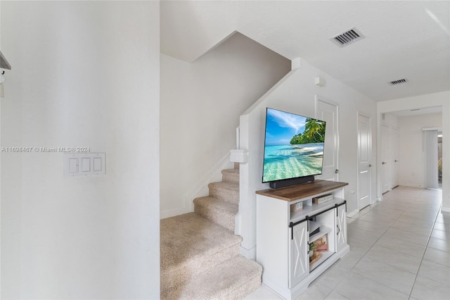 interior space with light tile patterned floors