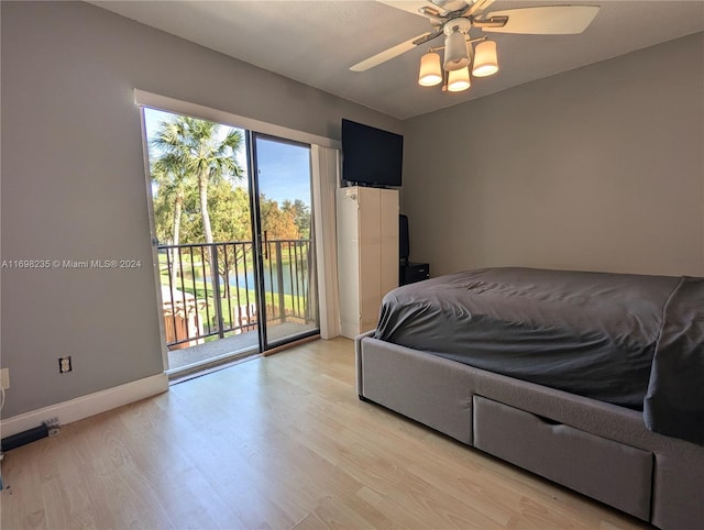 bedroom featuring ceiling fan, light hardwood / wood-style floors, and access to outside