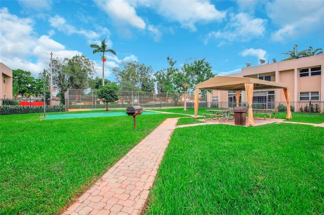 surrounding community with a gazebo and a lawn