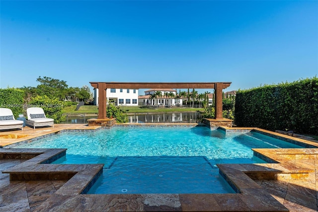 view of swimming pool featuring a water view