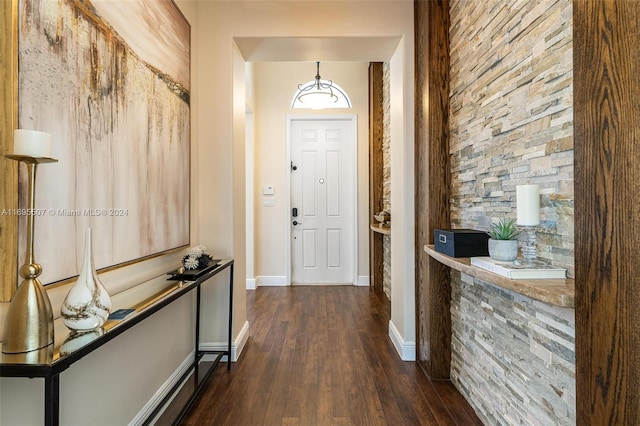 entryway with dark hardwood / wood-style floors