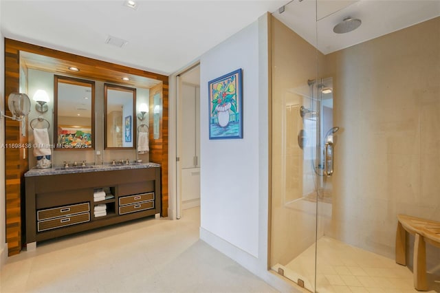 bathroom featuring vanity and an enclosed shower