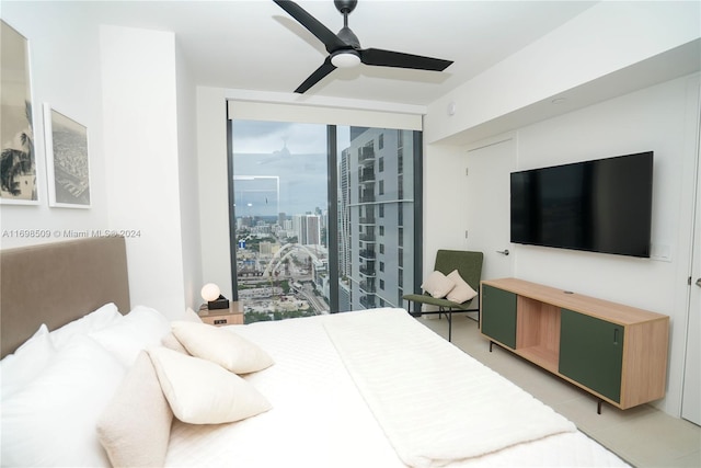 bedroom featuring ceiling fan and light tile patterned flooring