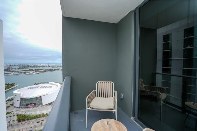 balcony with central air condition unit and a water view