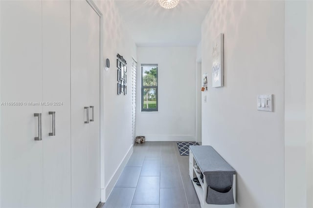 hall featuring tile patterned flooring