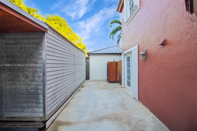 view of side of property featuring a patio area