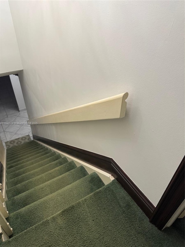 stairs featuring tile patterned flooring