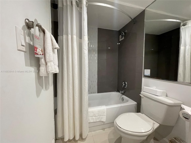 bathroom featuring tile patterned floors, toilet, and shower / tub combo